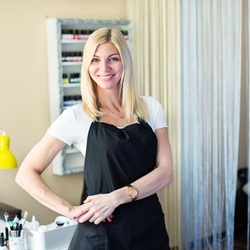 Emily, nail artist and salon owner using our nail glue and remover